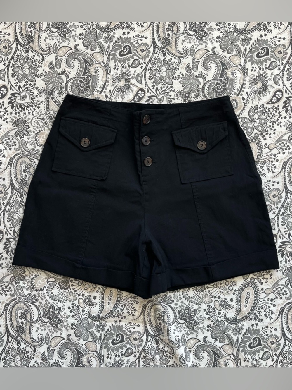 Black high-waisted button-up shorts with pockets